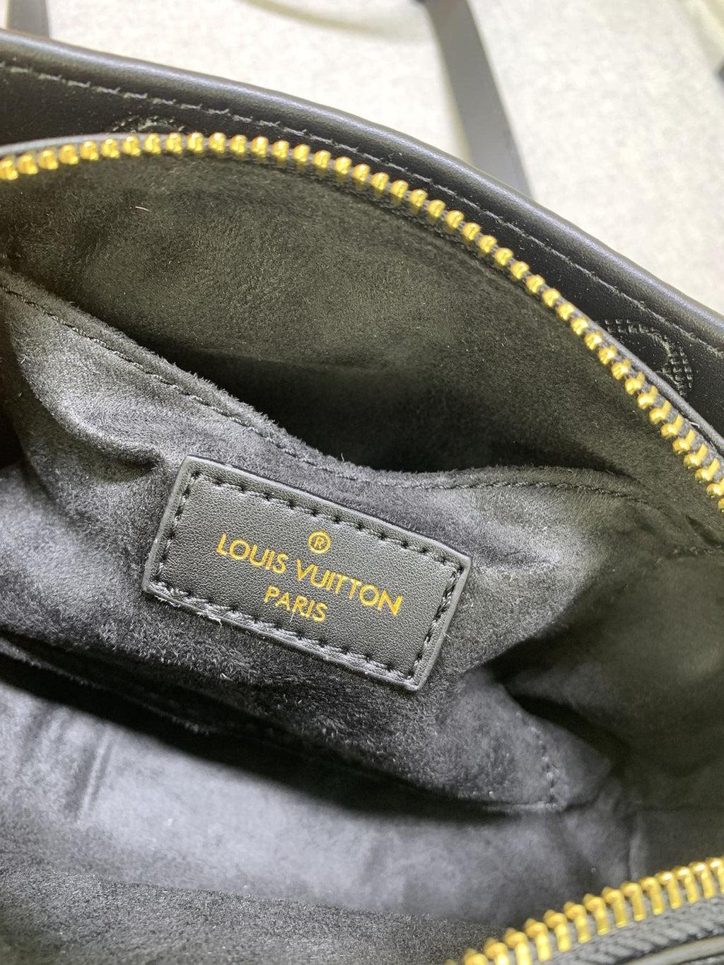 Louis Vuitton OnTheGo East West Embossed Leather Handbag — detail