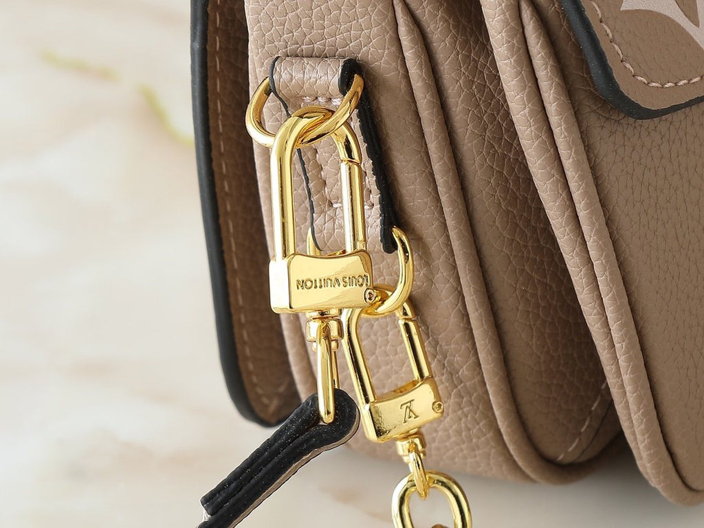 Louis Vuitton Pochette Métis East West Monogram Empreinte Bag — detail