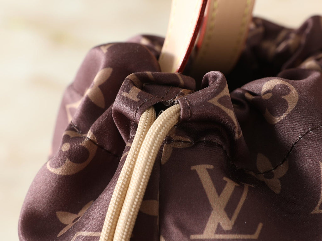Louis Vuitton Keeper Monogram Drawstring Clutch — detail