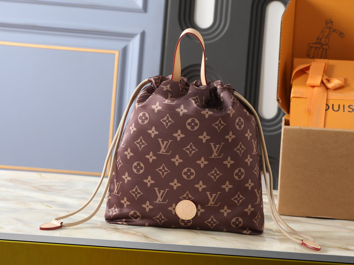Louis Vuitton Keeper Monogram Drawstring Clutch — hero