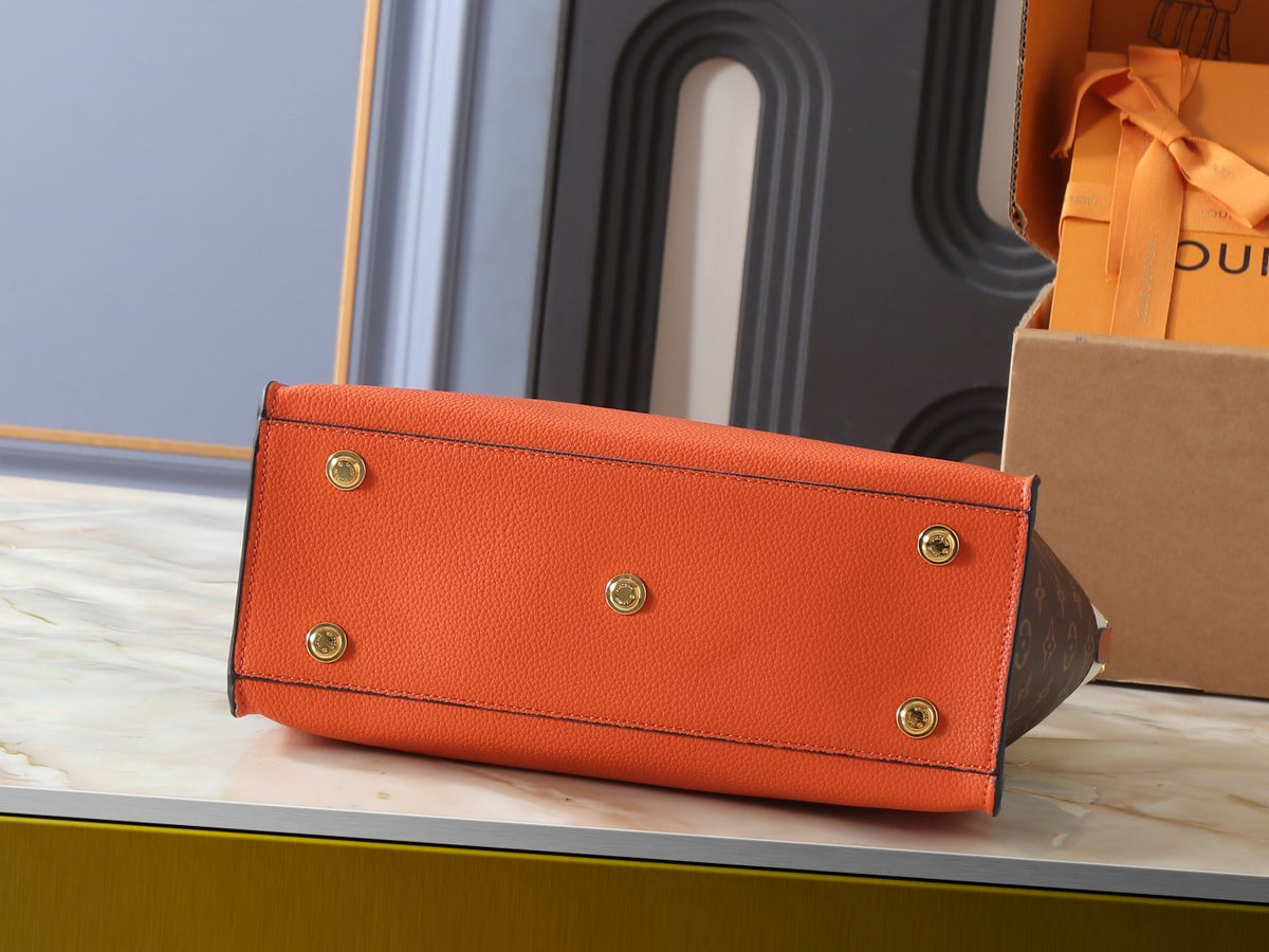 Louis Vuitton On My Side Turn-Lock Tote — detail