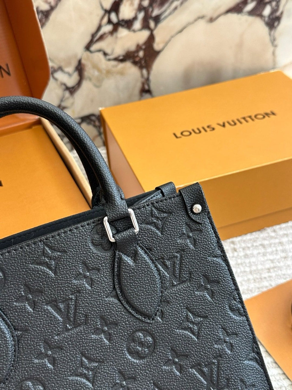 Louis Vuitton Onthego Black Embossed Tote — detail