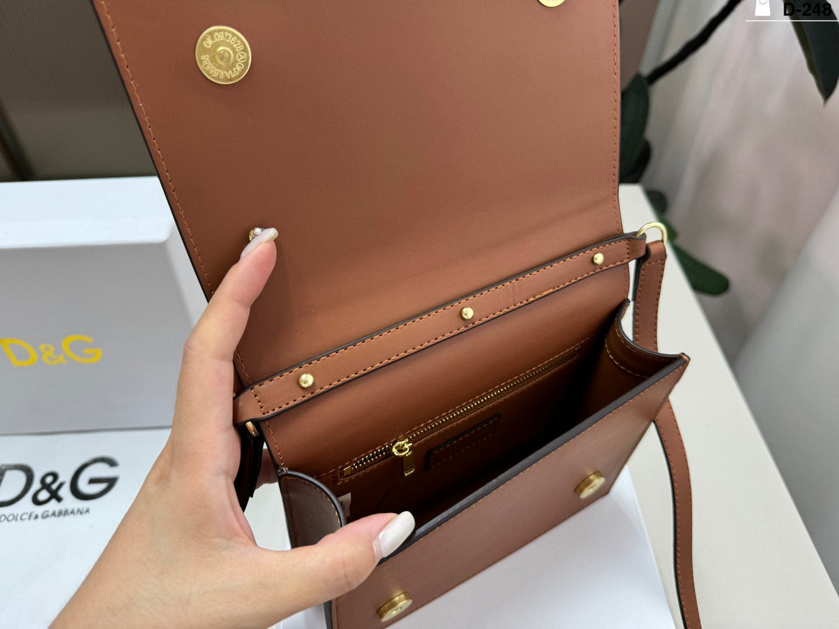 Dolce & Gabbana Raised DG Flap Crossbody Bag — front
