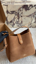 Coach Rounded-Tab Bucket Bag — hero