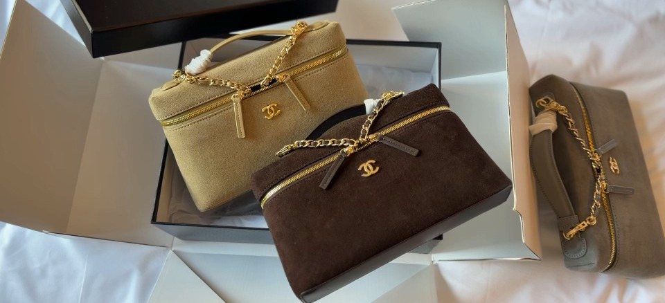 Chanel Suede-Textured Zip-Front Top-Handle Bag — comparison