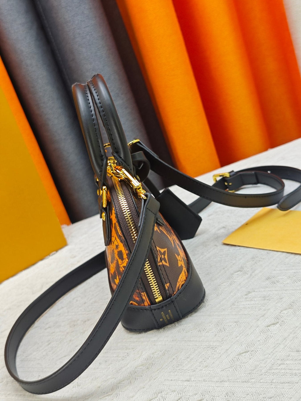 Louis Vuitton Alma BB Domed Top-Handle Bag — side