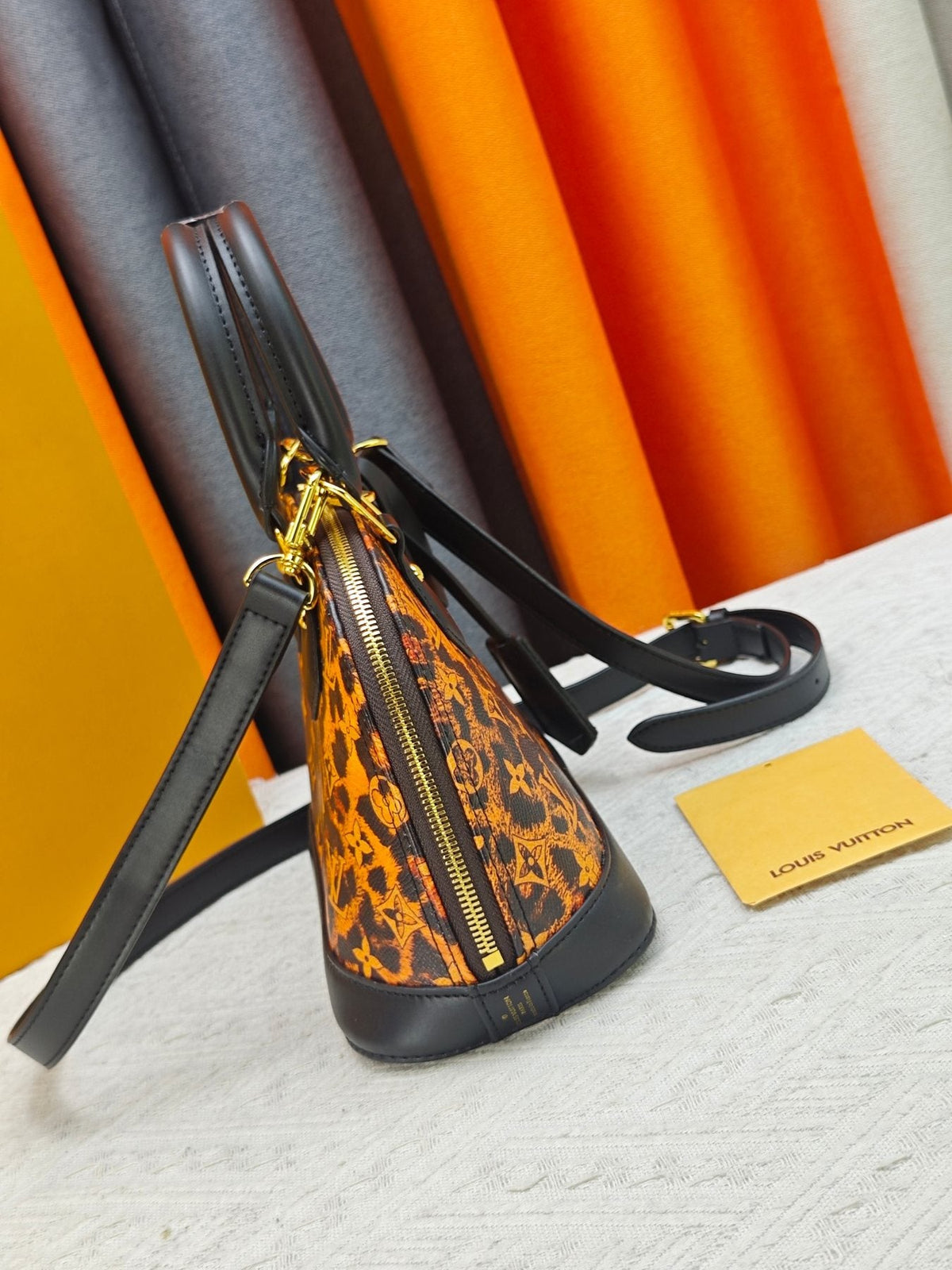 Louis Vuitton Alma BB Domed Top-Handle Bag — side