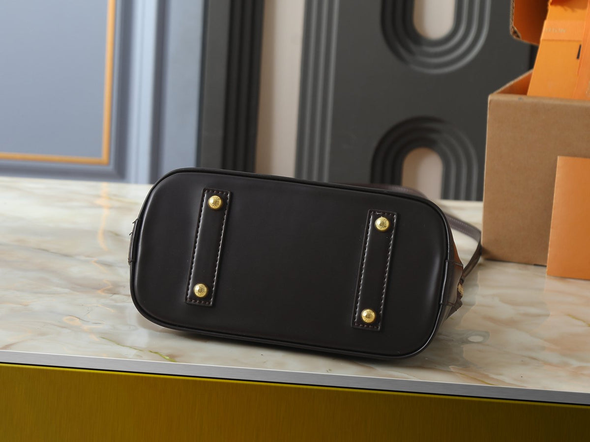 Louis Vuitton Alma Structured Top-Handle Bag — detail