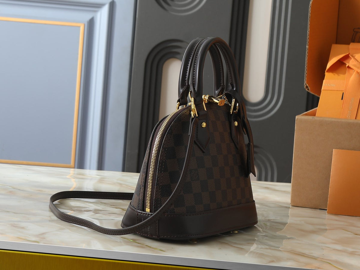 Louis Vuitton Alma Structured Top-Handle Bag — side