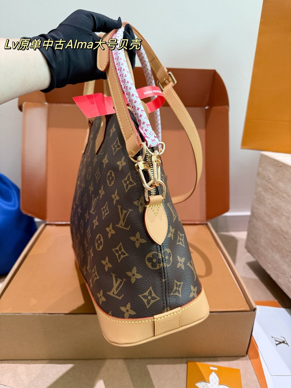 Louis Vuitton Alma Monogram Handbag with Pink Strap — side