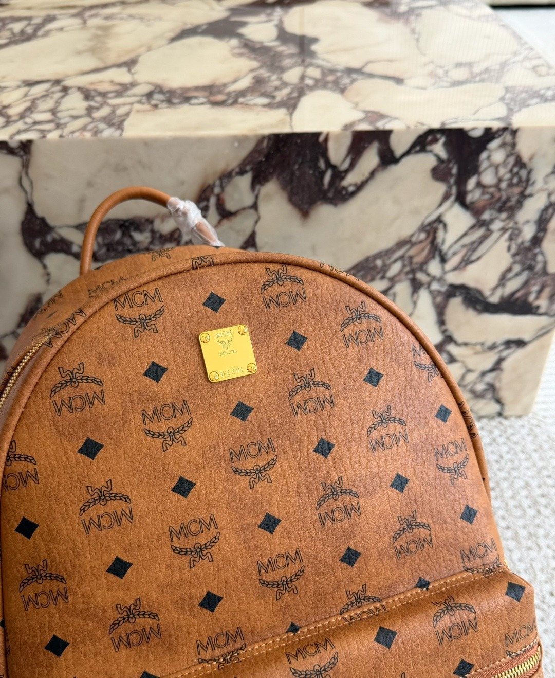 MCM Studded Monogram Backpack — detail