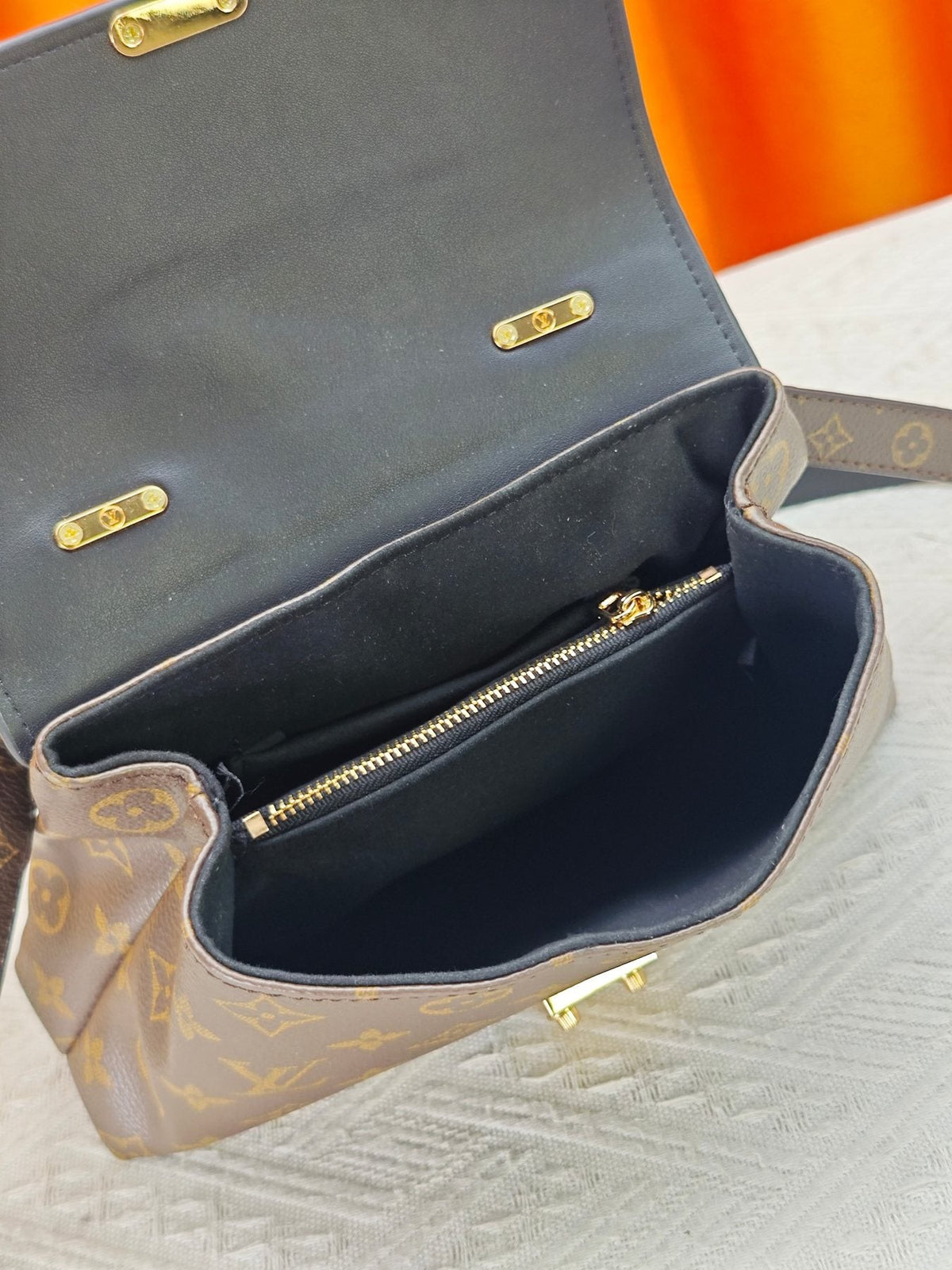 Louis Vuitton Madeleine BB Monogram Top-Handle Bag — detail