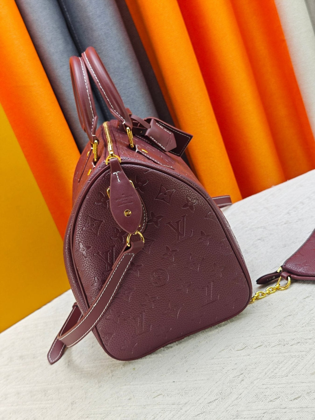 Louis Vuitton Speedy Bandoulière Burgundy Embossed Monogram Bag — side