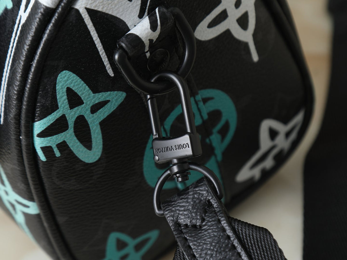 Louis Vuitton Keepall Bandoulière Duffel Bag — detail