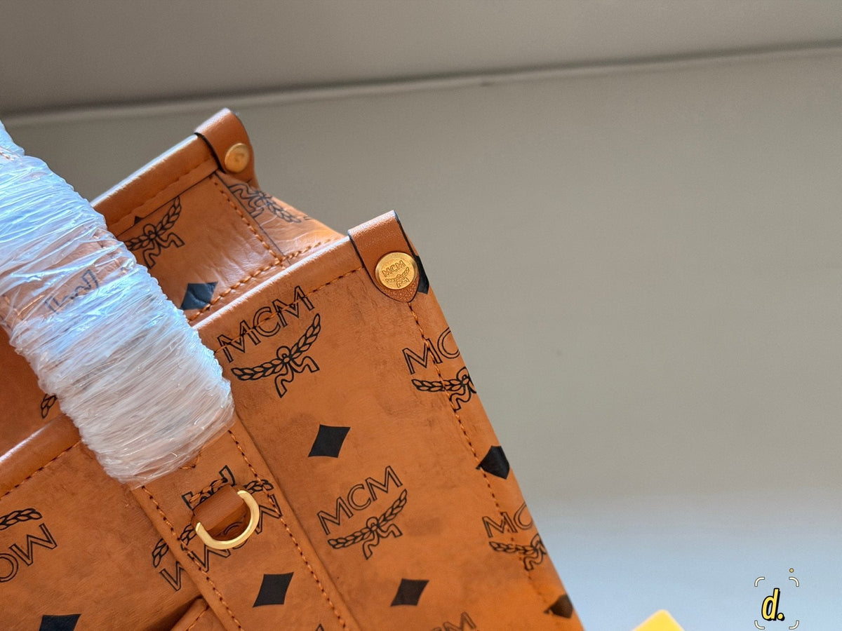 MCM Structured Monogram Tote with Front Plaque — detail