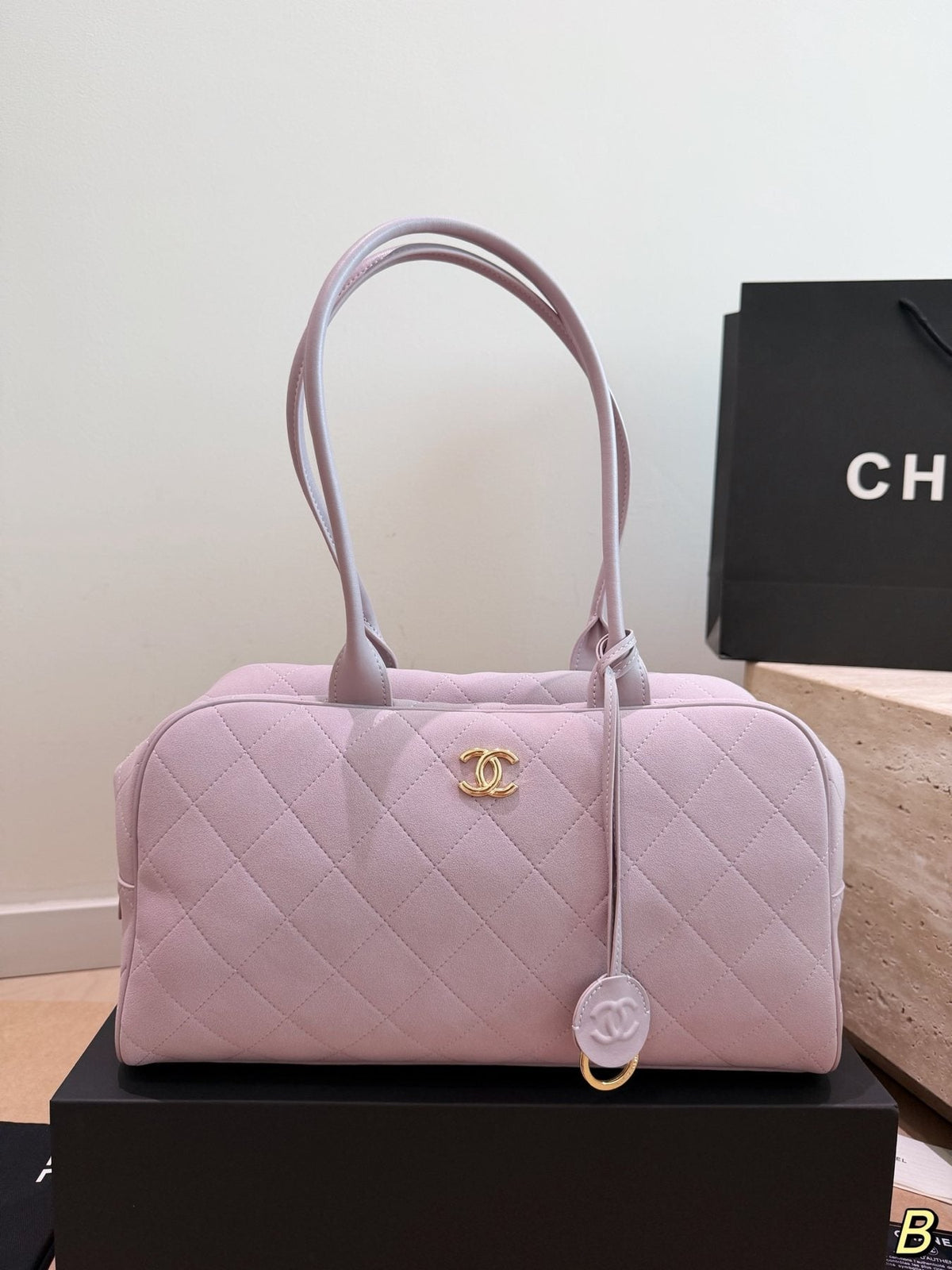 Chanel Diamond-Quilted Bowling Bag with Round Charm — front