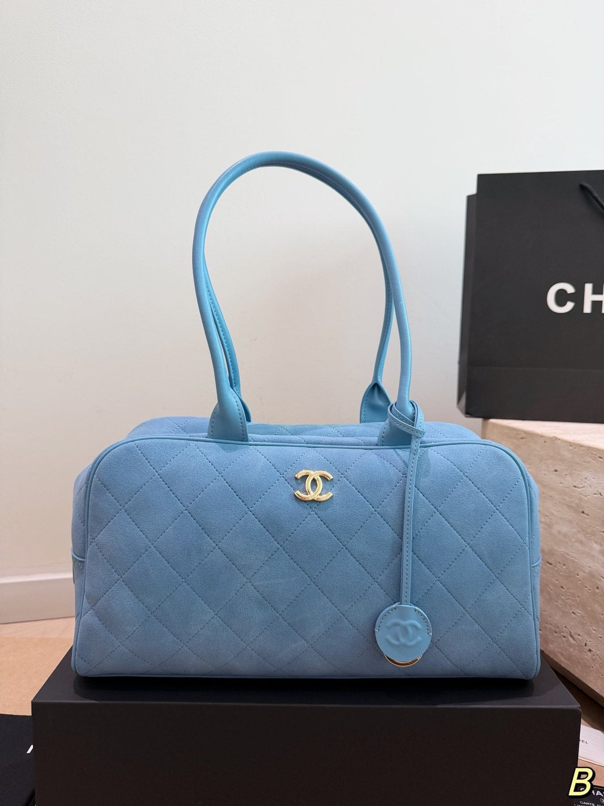 Chanel Diamond-Quilted Bowling Bag with Round Charm — front