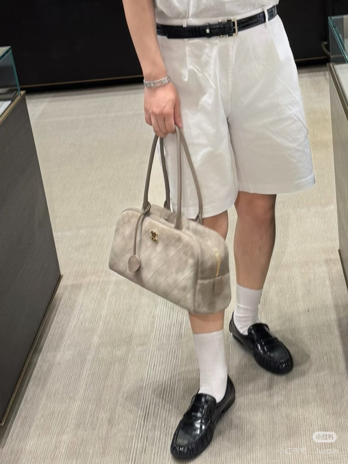 Chanel Diamond-Quilted Bowling Bag with Round Charm — model