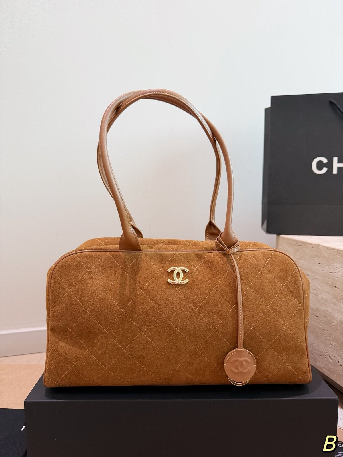 Chanel Diamond-Quilted Bowling Bag with Round Charm — front