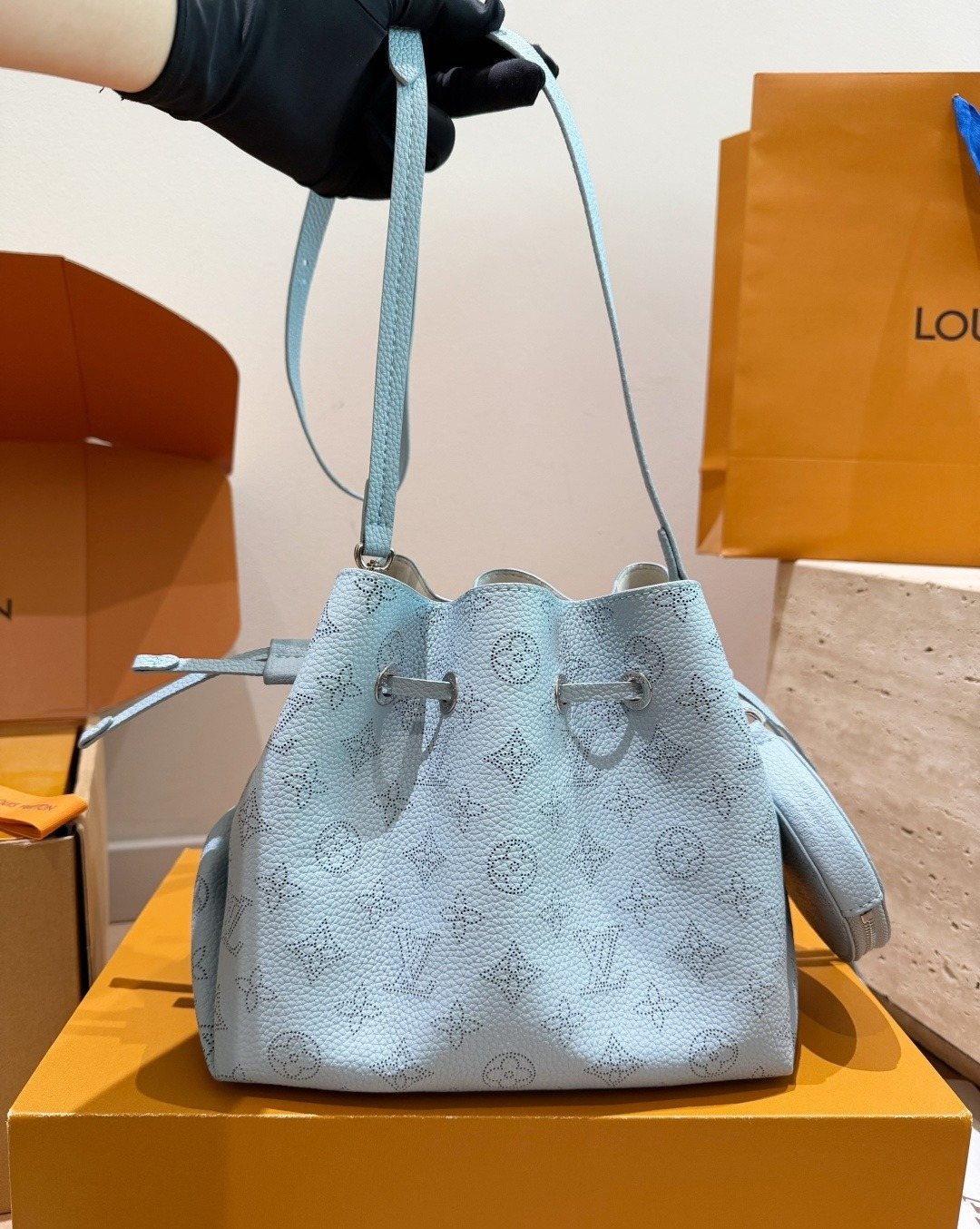 Louis Vuitton Bella Monogram Bucket Bag — model