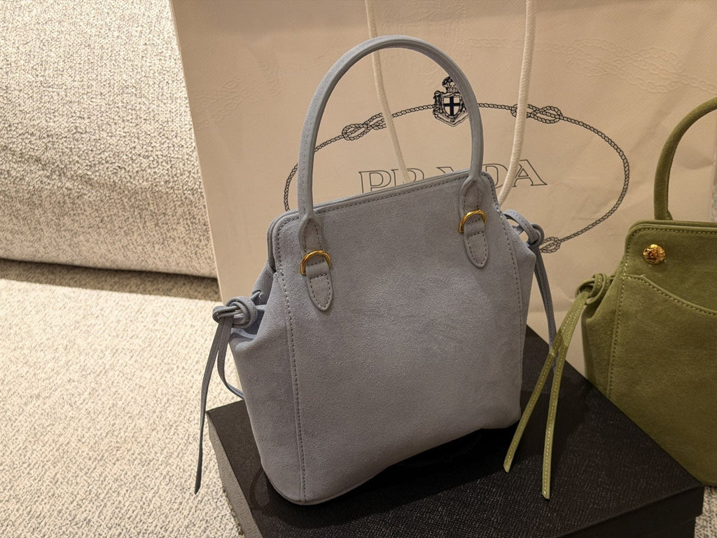 Prada Curved-Pocket Top-Handle Bag — comparison