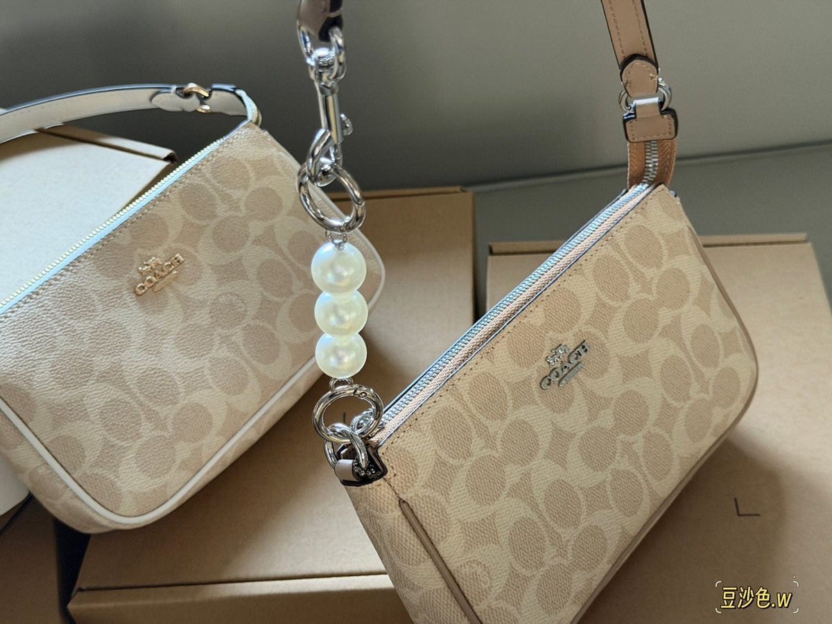 Coach Nolita Zip-Top Shoulder Bag — comparison