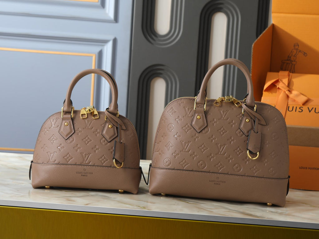 Louis Vuitton Neo Alma Empreinte Top-Handle Bag — comparison