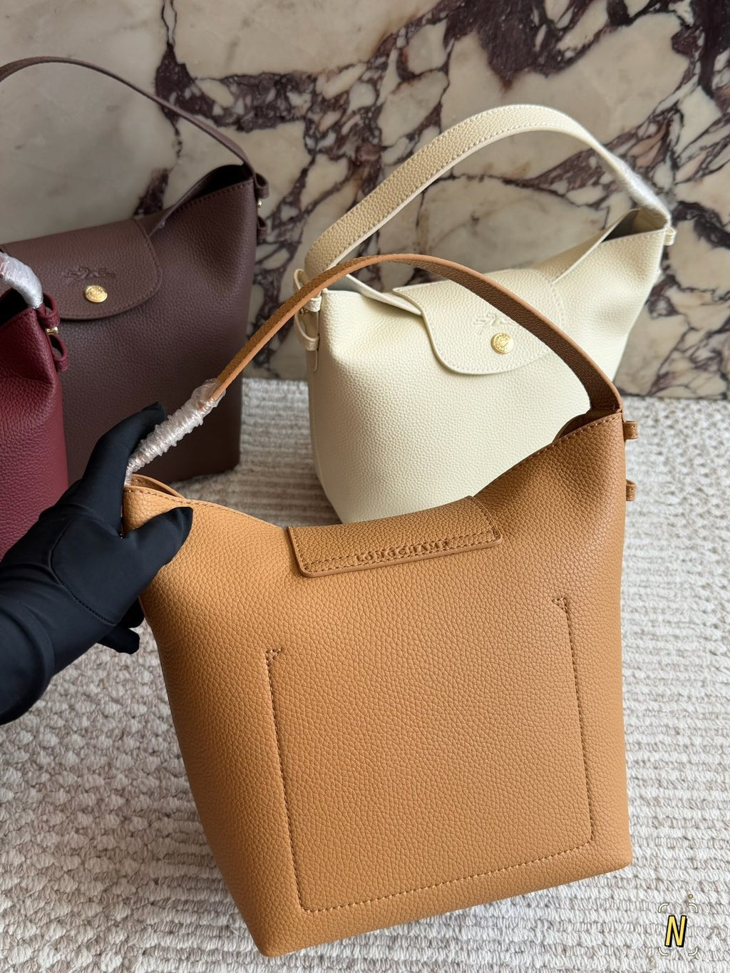 Longchamp Pebbled Bucket Bag with Rounded Snap Flap — back
