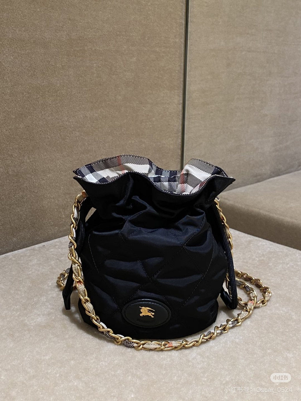 Black Quilted Chain-Strap Bucket Bag — detail