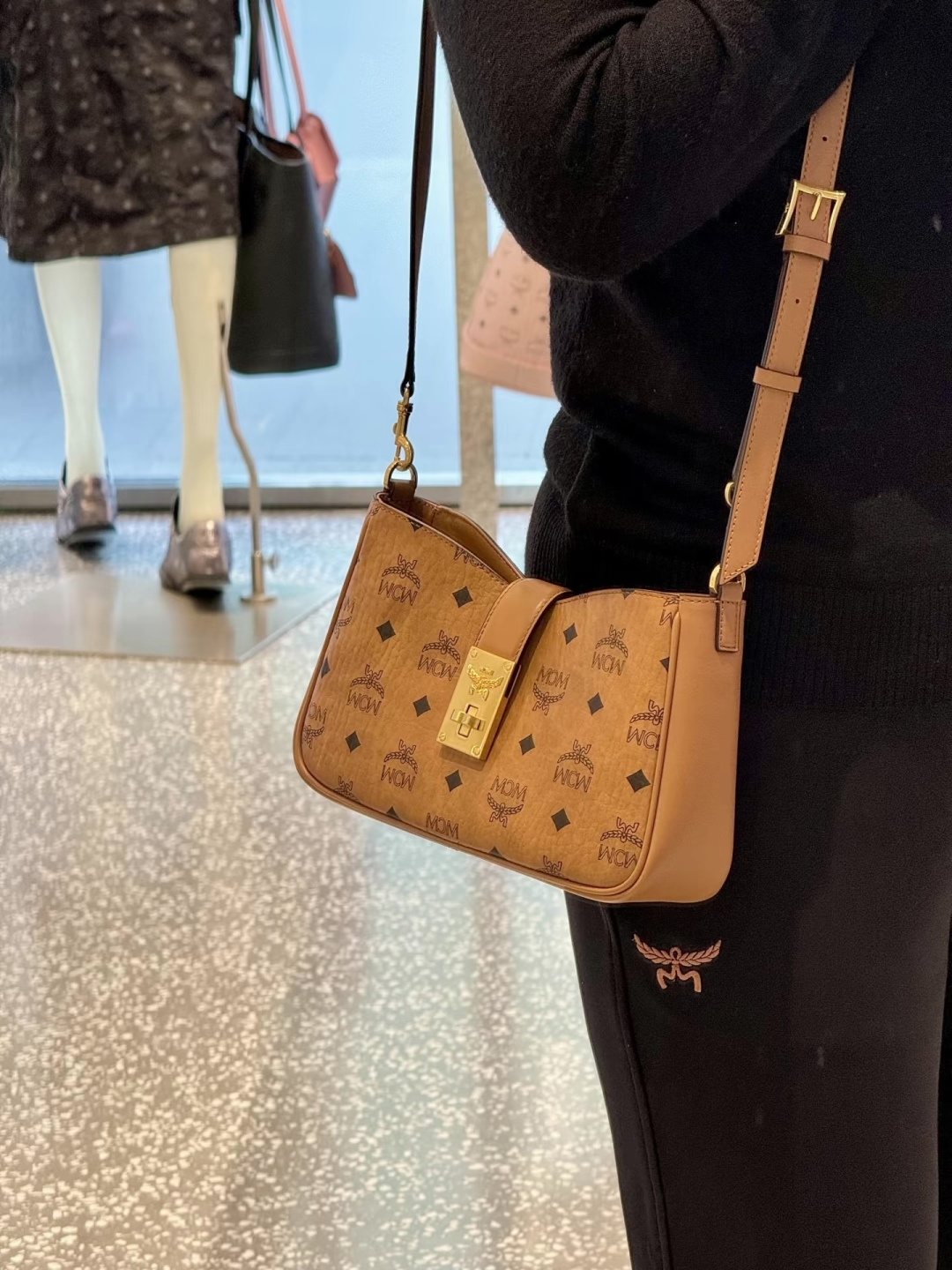 MCM Monogram Hobo Bag with Gold-Tone Clasp — model