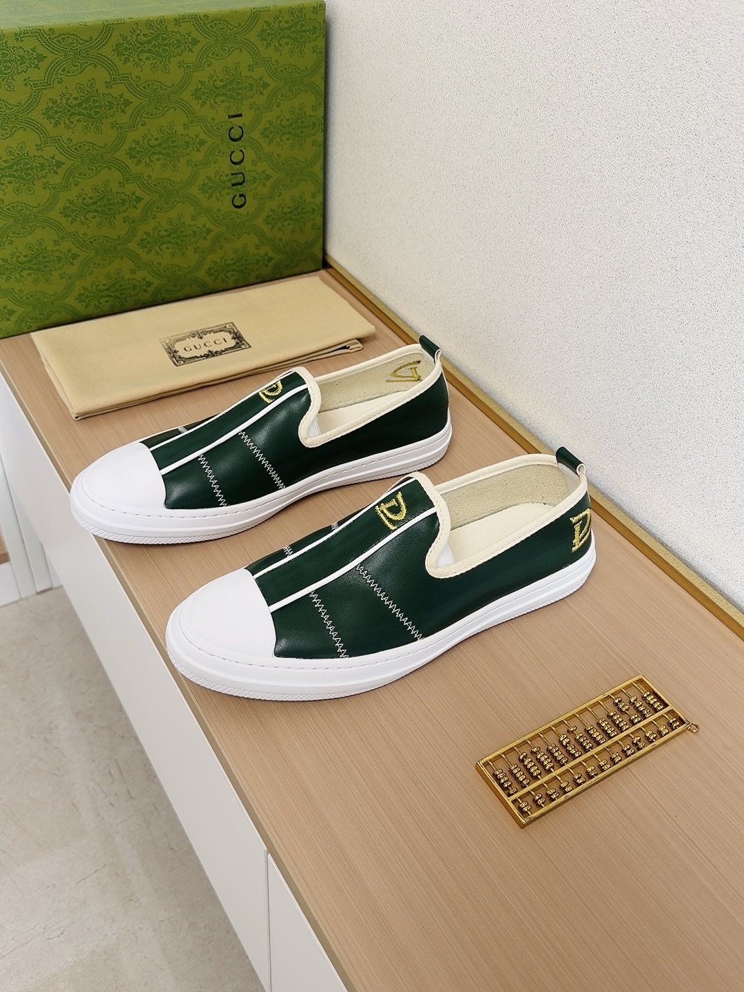 Gucci Brown Slip-On Sneakers with White Toe Caps — front