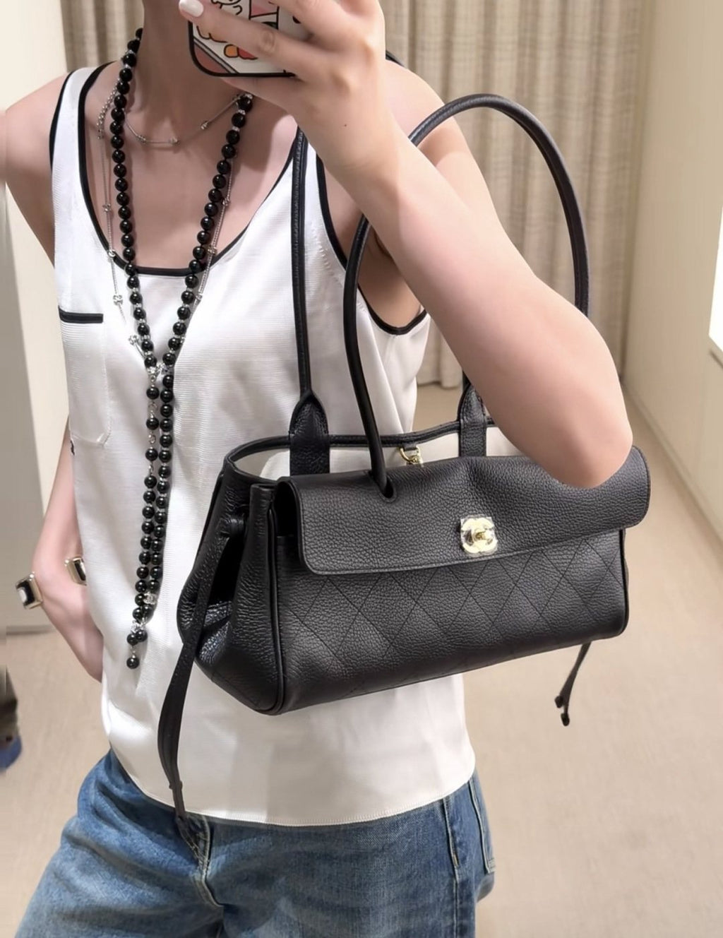 Chanel Quilted Baguette Shoulder Bag — model