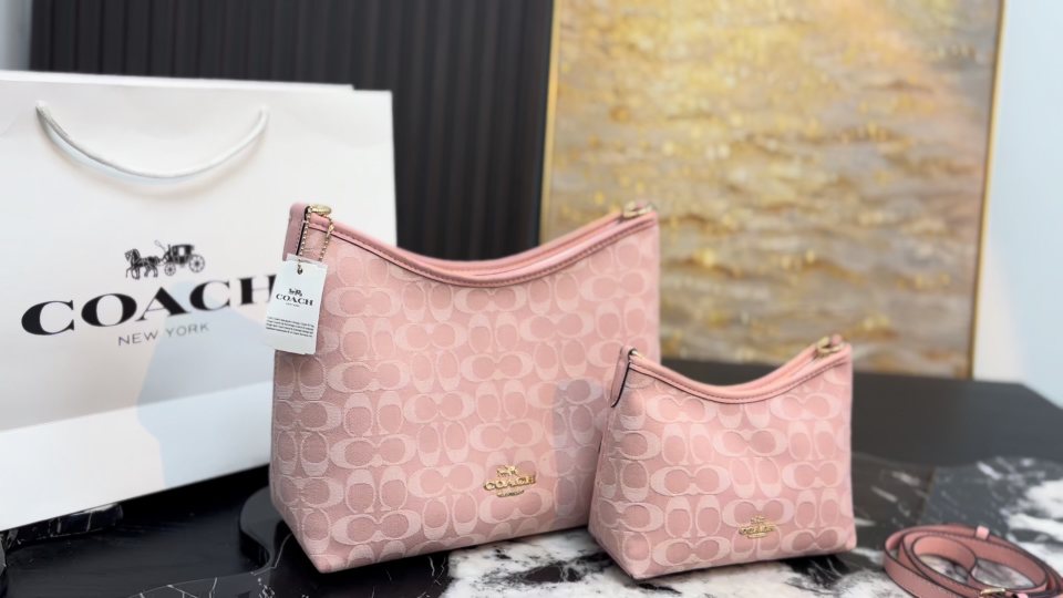 Coach Laurel Pink Signature Shoulder Bag — comparison