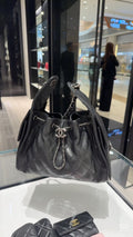 Chanel 25 Quilted Drawstring Bucket Bag — hero