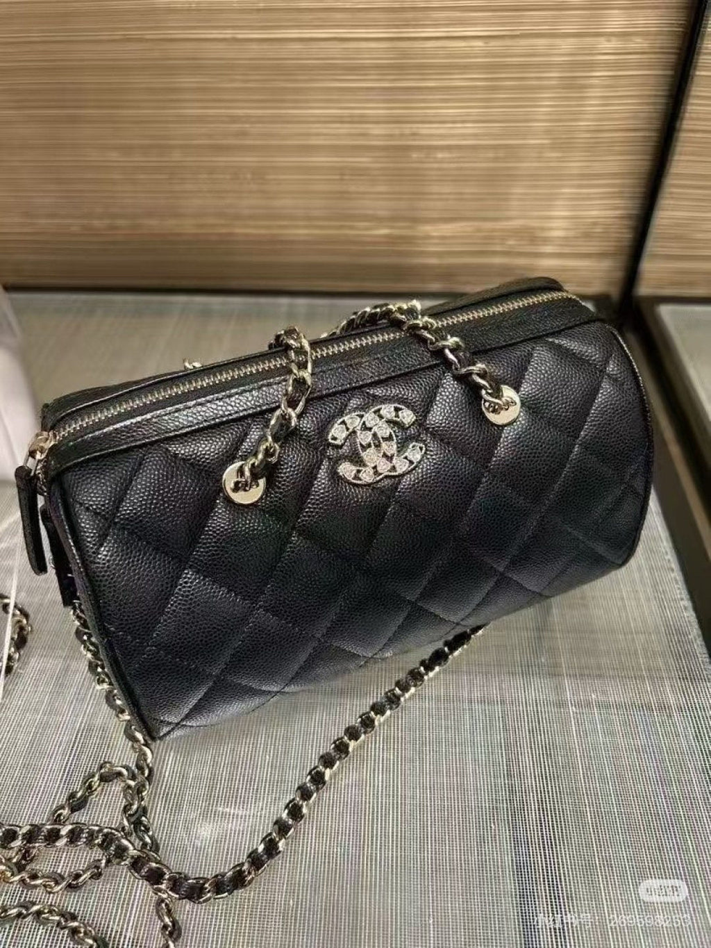 Chanel Quilted Bowling Bag with Jeweled CC Emblem — detail