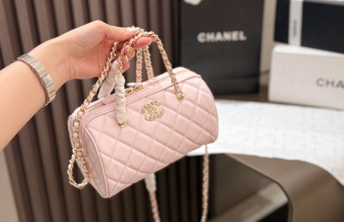 Chanel Quilted Bowling Bag with Jeweled CC Emblem — model