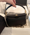 Chanel Quilted Curved-Flap Top-Handle Bag — hero