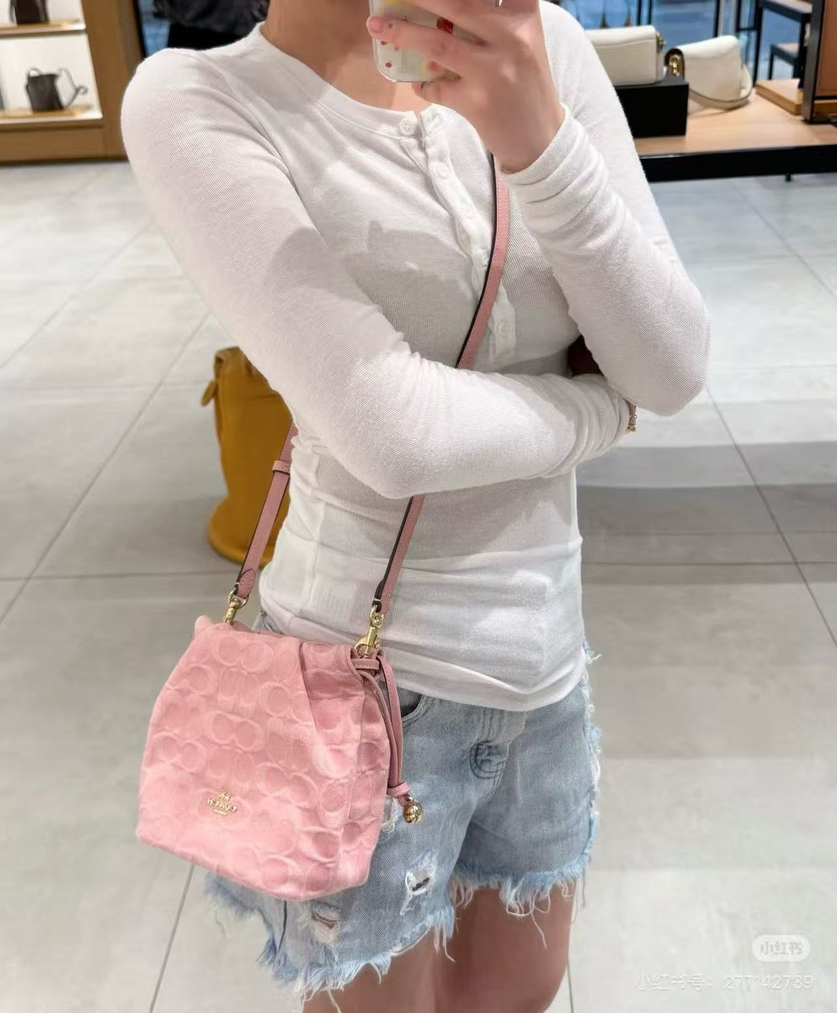 Coach Pink C-Pattern Drawstring Bucket Bag — model