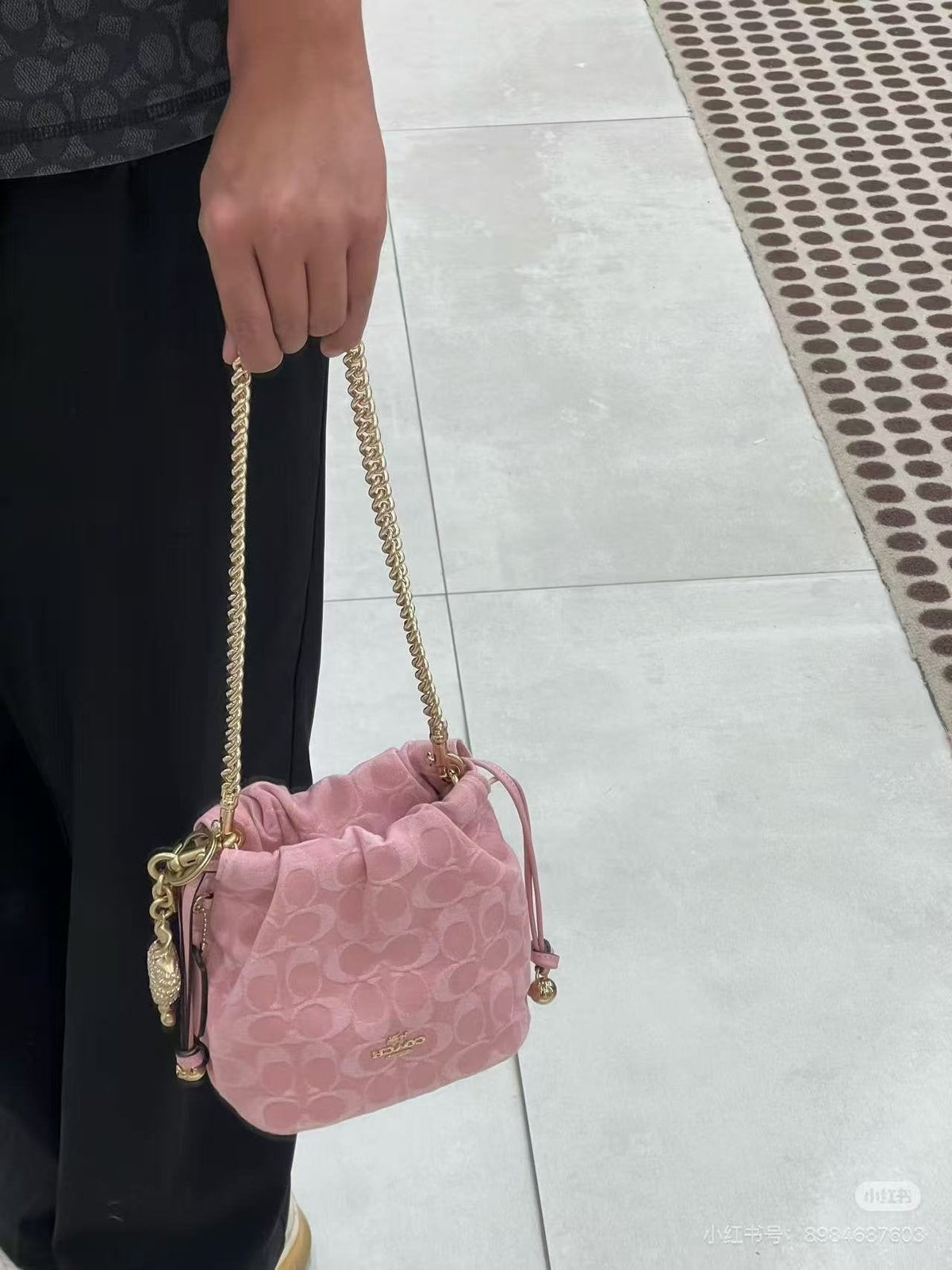 Coach Pink C-Pattern Drawstring Bucket Bag — model