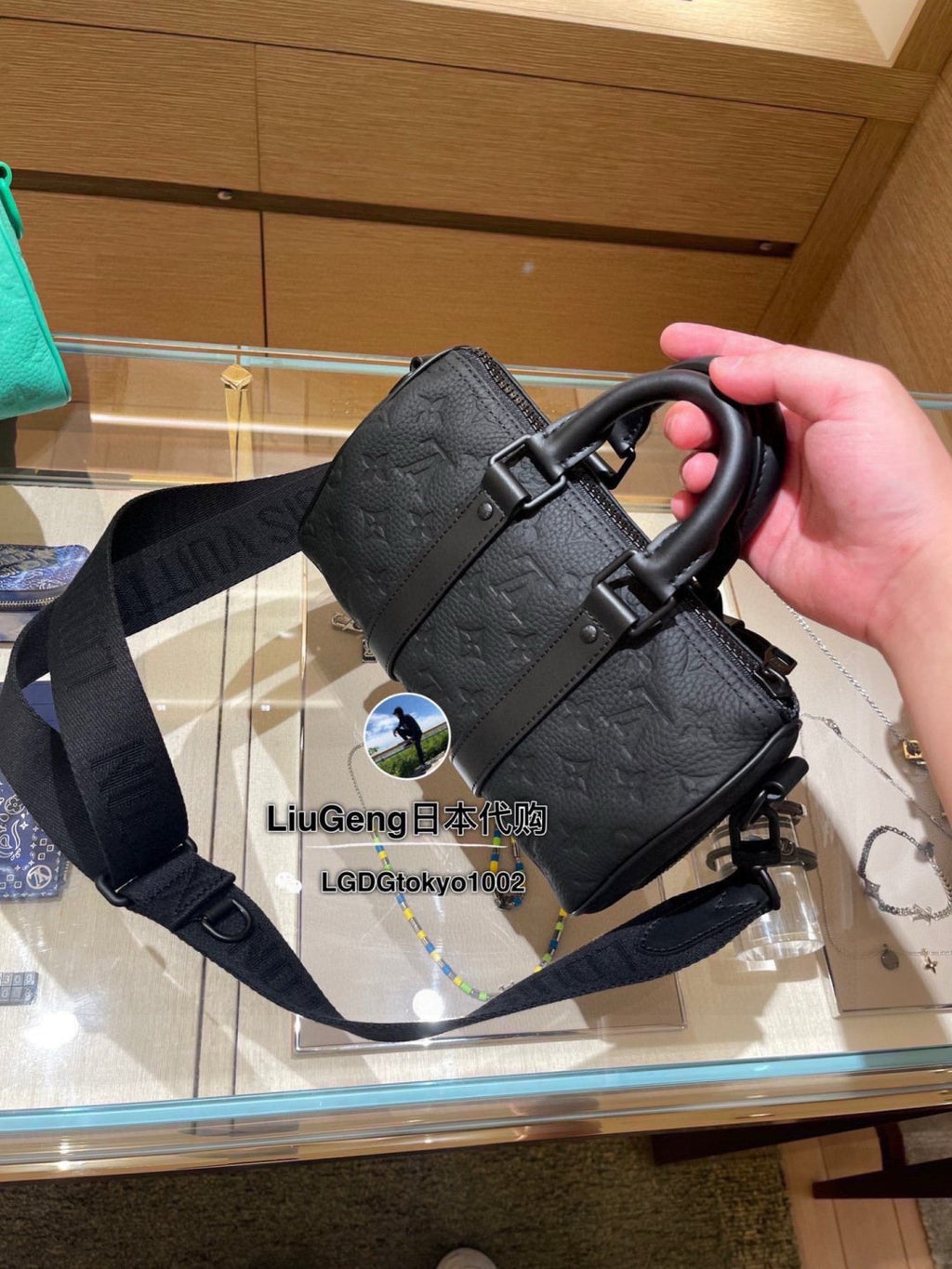 Louis Vuitton Keepall Embossed Monogram Duffel Bag — side