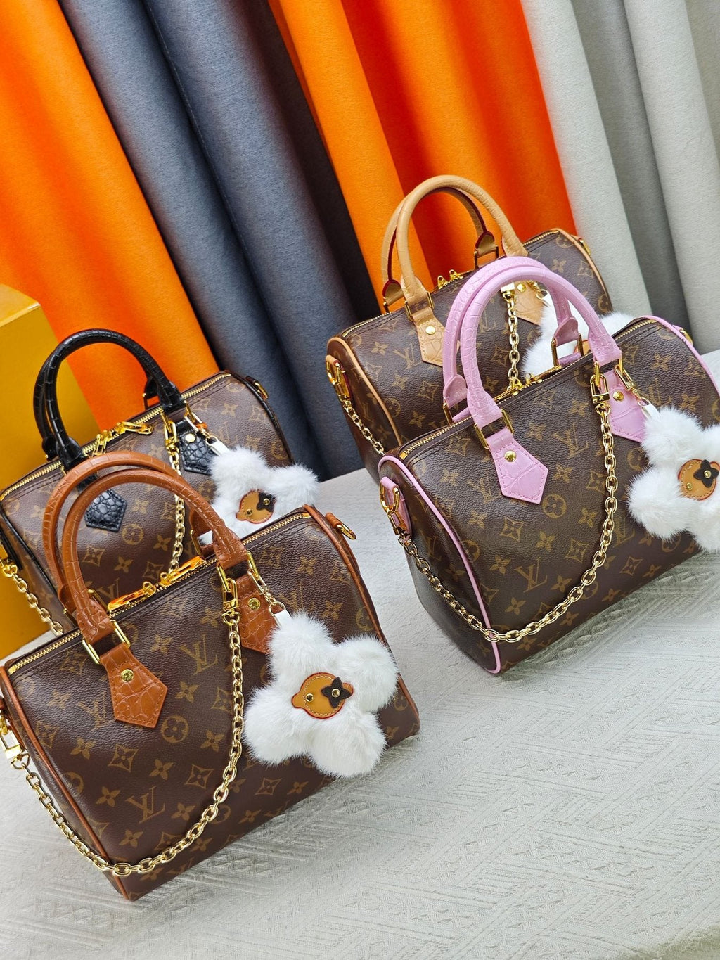 Louis Vuitton Speedy Bandoulière Monogram Satchel with Flower Ornament — comparison