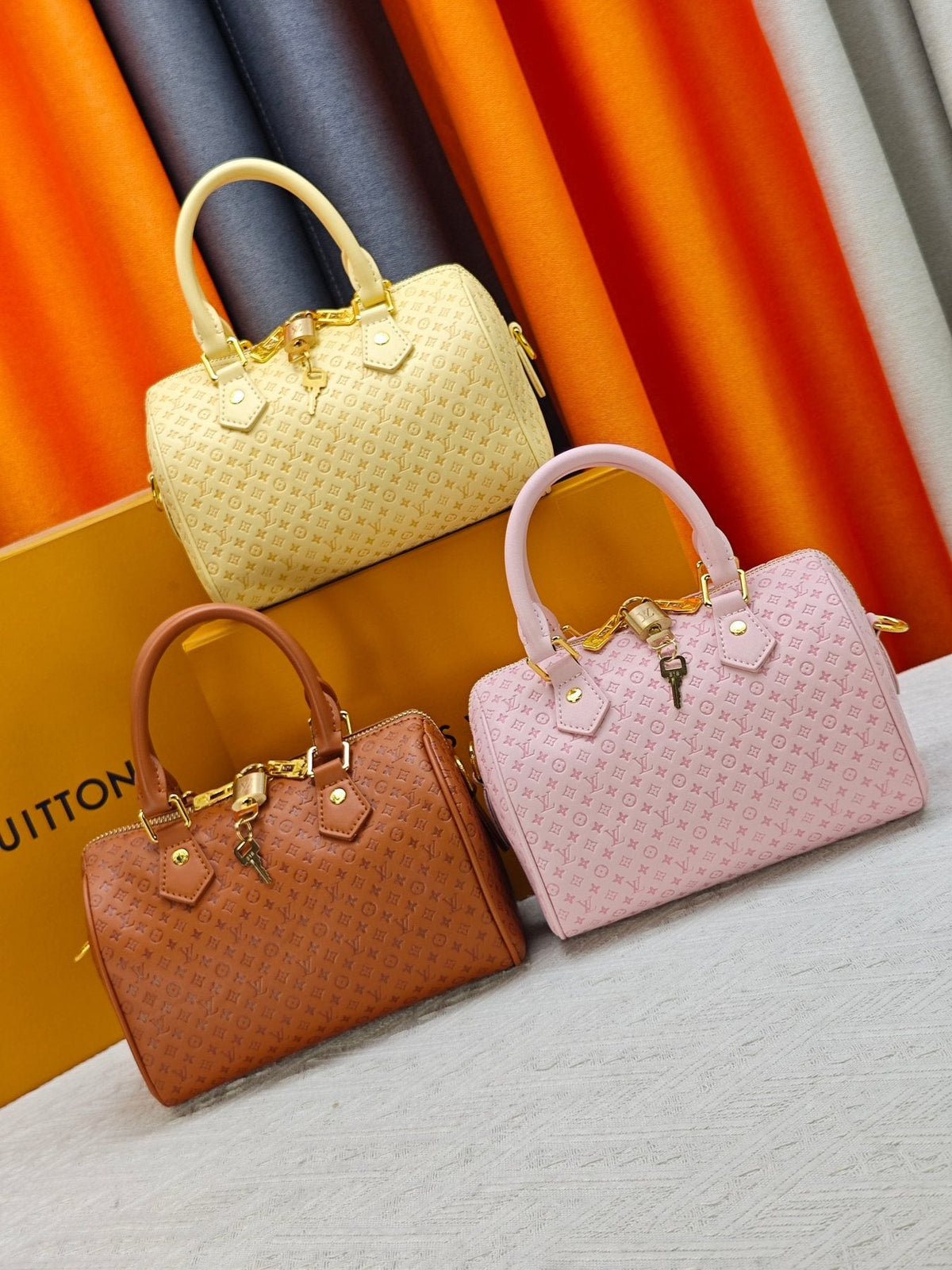 Louis Vuitton Speedy Bandoulière Embossed Monogram Satchel — comparison