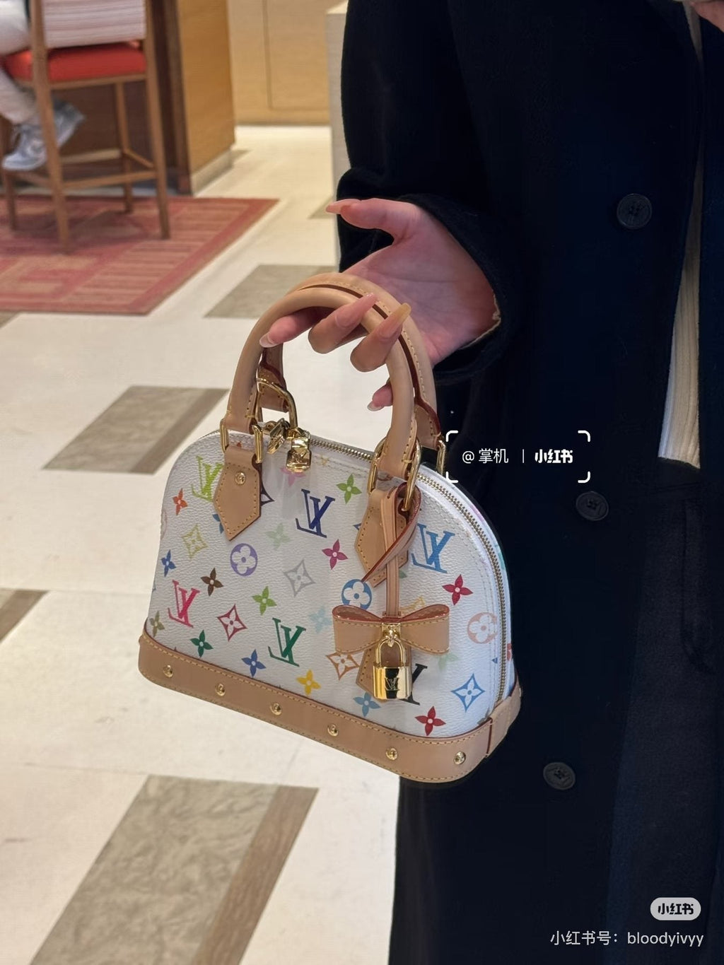 Louis Vuitton Alma Multicolor Monogram Top-Handle Bag — model