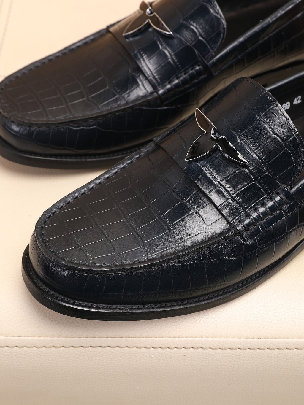 Louis Vuitton Embossed Strap Loafers — detail