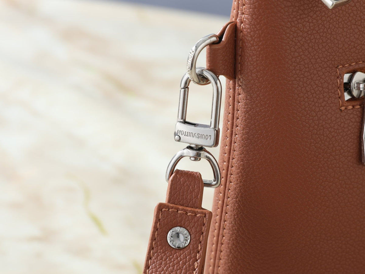 Louis Vuitton Takeoff Leather Wristlet Clutch — detail
