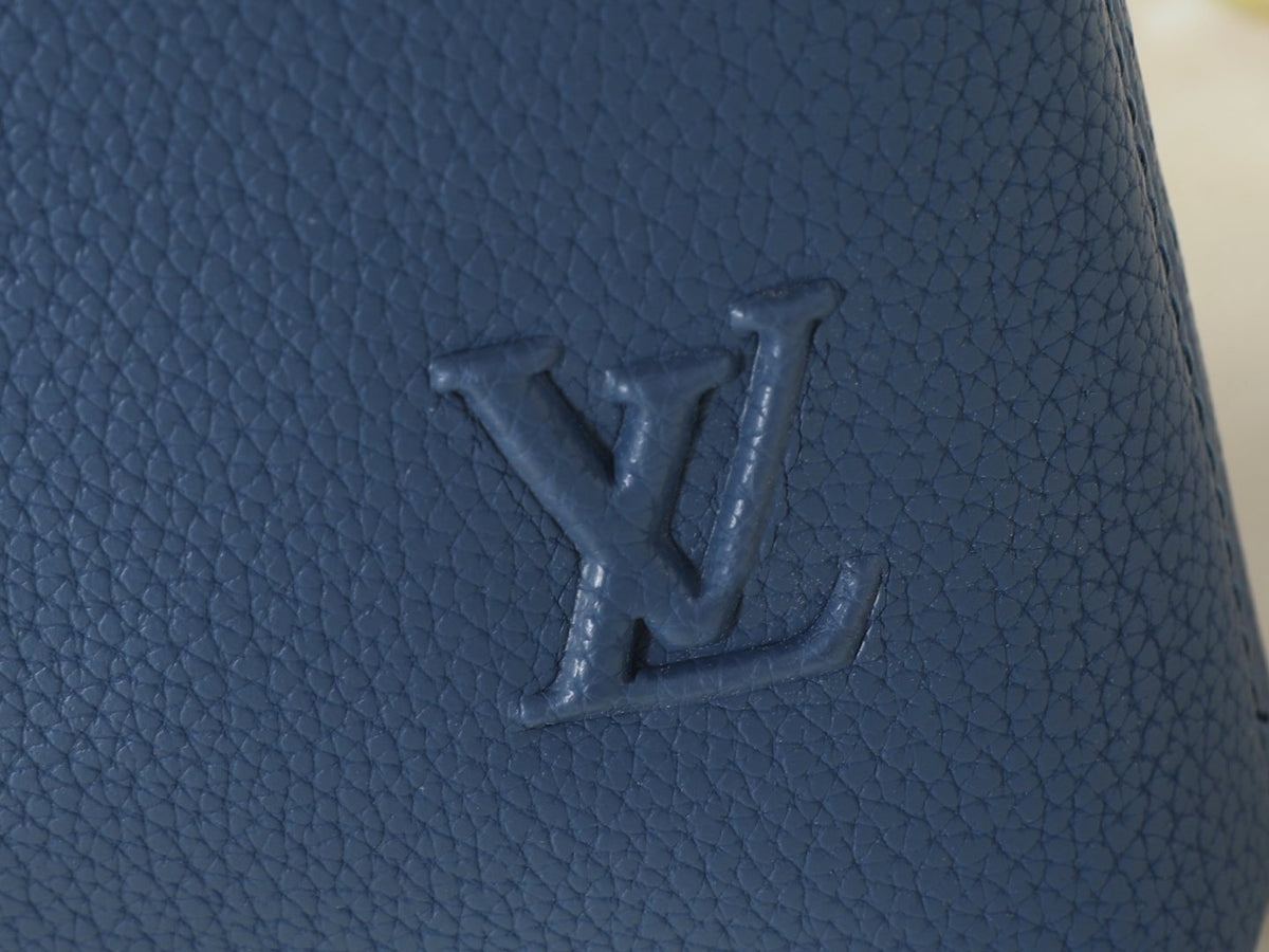 Louis Vuitton Takeoff Leather Wristlet Clutch — detail