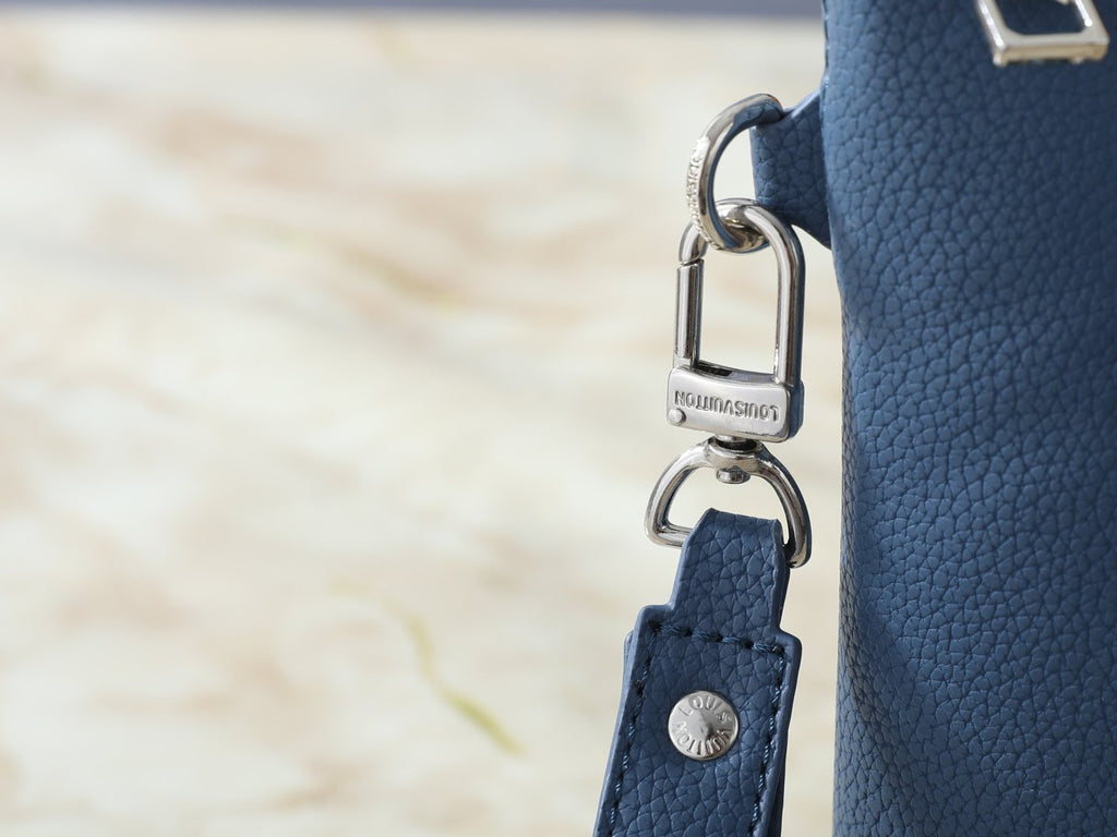 Louis Vuitton Takeoff Leather Wristlet Clutch — detail