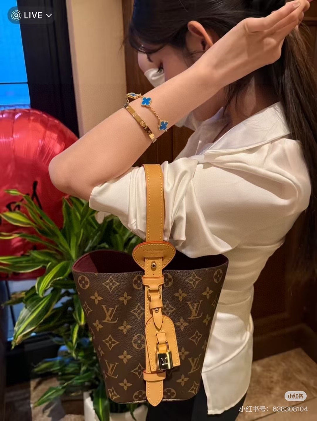 Louis Vuitton Monogram Buckle-Strap Bucket Bag — model