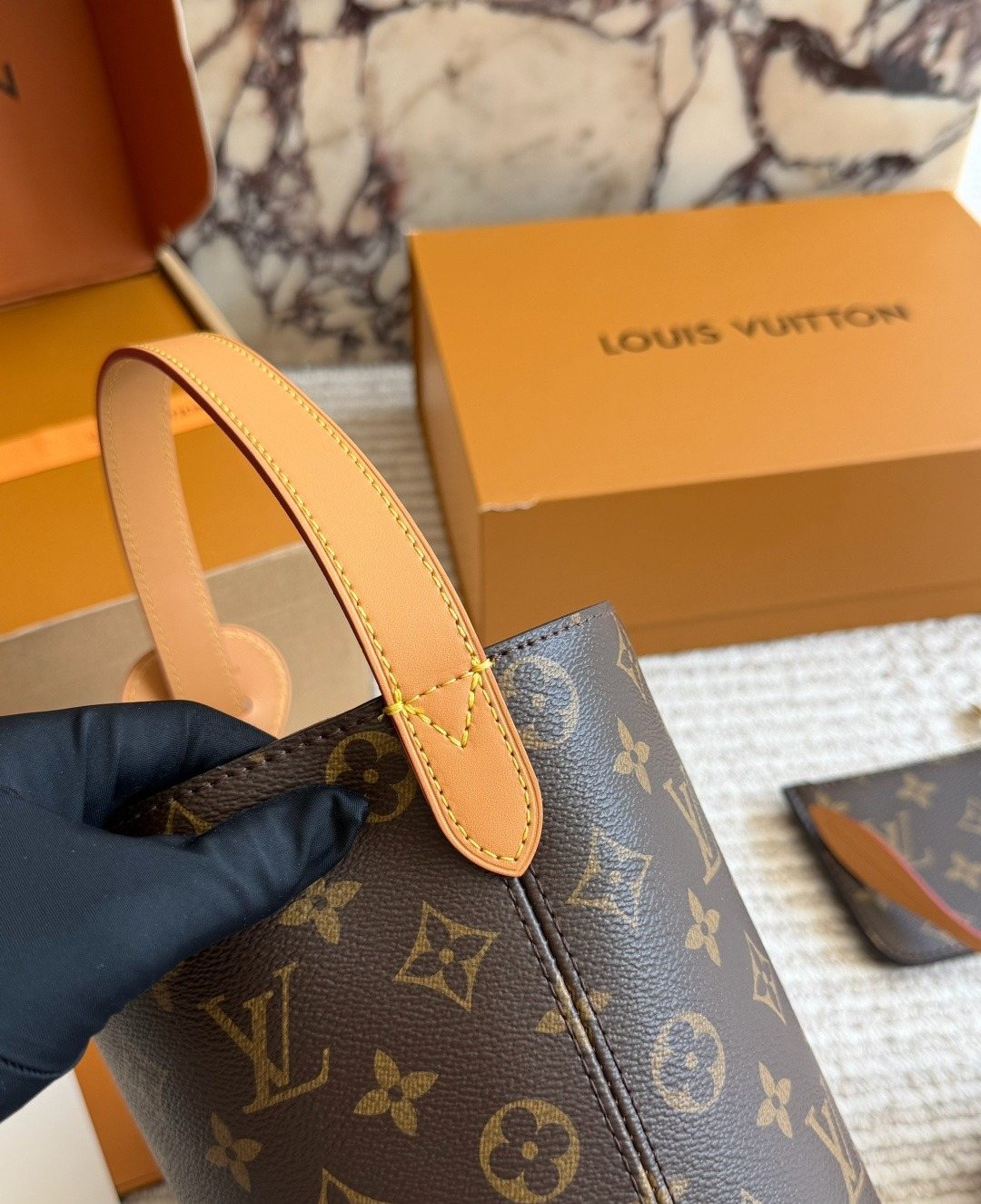 Louis Vuitton Monogram Buckle-Strap Bucket Bag — detail