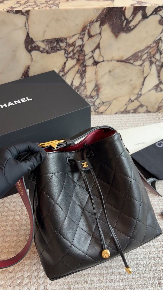 Chanel Diamond-Quilted Drawstring Bucket Bag — hero